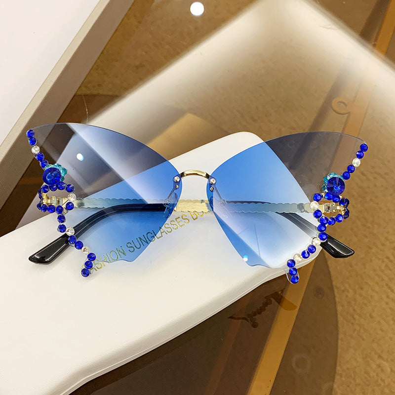 Gafas de sol de PC sin borde de diamante de forma de mariposa al por mayor